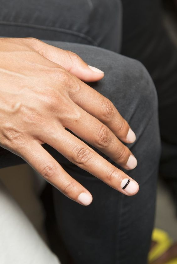 Premium Photo | Beige manicure with black lines on different nail shapes
